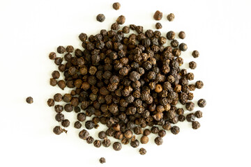 Black whole peppercorns peas close-up as a background. Spices of Cambodia. Seasoning for dishes. Additive ingredient for the preparation of delicious delicacies.