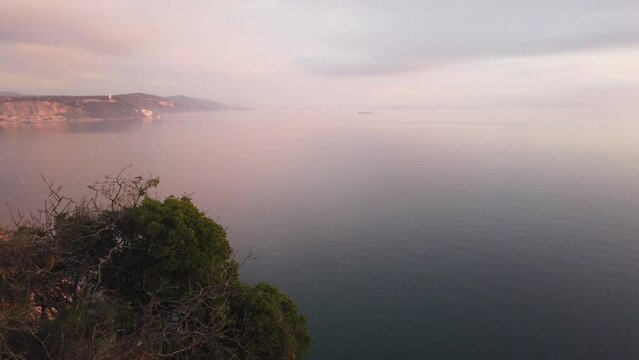 Duino cliffs and Adriatic coastline during a winter sunset near Trieste, Italy