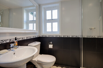 Tiled black and white shower room