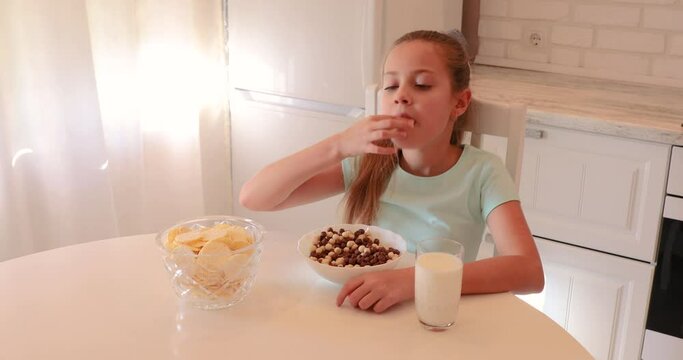 girl throws cookies. useful funny breakfast