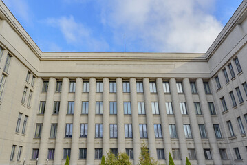 Part of facade of european building with blue windows close