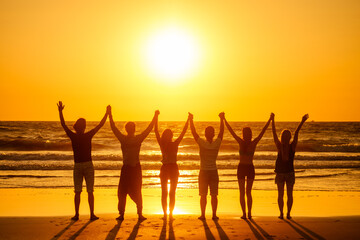 six health people in stand hatha position with hand up raced and breath full chest in Goa India...