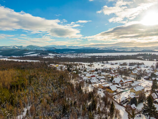 Aerial drone landscape view of Low Tatras mountains (Nizke Tatry). Winter cold weather, blue sky.