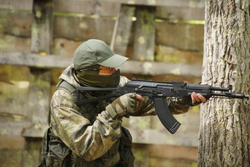 Fototapeta premium soldier with guns, airsoft russia, russian soldier in the woods with guns