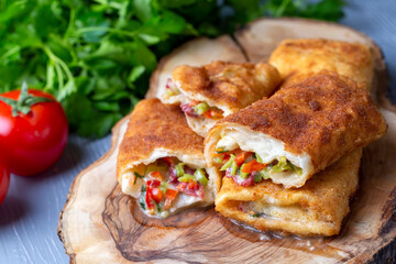 Turkish Pacanga Boregi with pastirma (pastrami) and cheddar (melted) cheese. - Pastirmali Borek