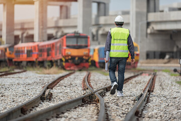 engineer walking on railway inspection. construction worker on railways. Engineer work on railway.rail,engineer,Infrastructure