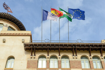 Flags on the university of Malaga in Spain