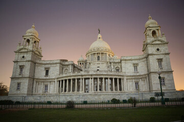 Fototapeta na wymiar The Queen Victoria Memorial, against the backdrop of the sunset sky, in the city of Kolkata