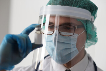 Professional medical doctor in hospital office. Portrait of young and confident physician. Medical...
