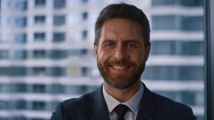 Corporate executive man smiling looking camera posing in start up office company