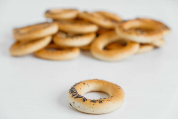 Dried bagels with poppy seeds on a white background