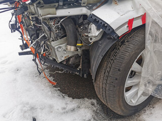Cleaning, washing with a special composition of the engine compartment of the car and engine. Service and repair of a modern car. Detergent foam on the elements of a car engine. Car wash.