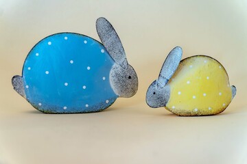 two metallic easter bunny rabbits on matt background, easter motive for postcards and easter...