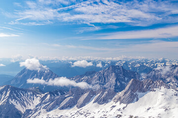 Fototapeta na wymiar Panoramic view of the European Alps from the top of Zugspitze on a sunny summer day