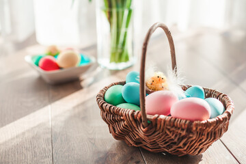 Fototapeta na wymiar Pastel colored Easter eggs in a basket
