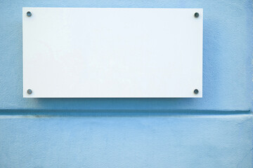 metal plate on blue wall