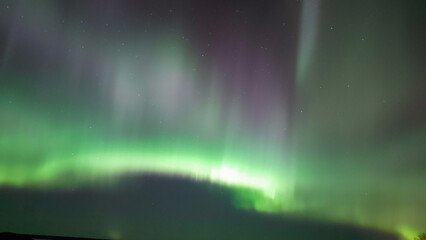 A strong band of green  and purple northern lights