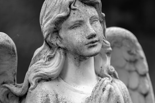 Black and white image of beautiful angel. Ancient statue.