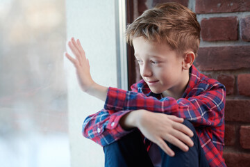 boy waving goodbye