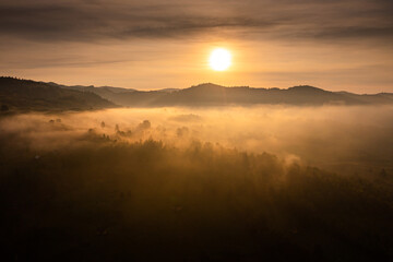 Aerial view over a rural village landscape in Bucovina, Romania, one of the most authentic landmarks in the country during sunrise