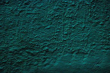 Petrol colored wall background with textures of different shades of teal