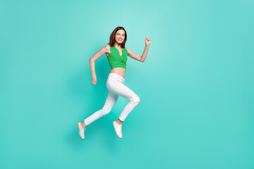 Fototapeta na wymiar Full body profile side photo of young girl run jump up active rush isolated over turquoise color background