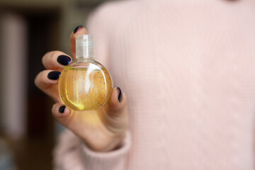 Woman applying antibacterial gel on her hands