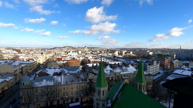 Time-lapse of the city landscape in winter, a panoramic view from the observation deck of the Church of Saints Elizabeth and Olga, on the buildings and cathedrals of Lviv