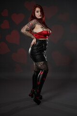 Beautiful large woman in red bra and mini skirt