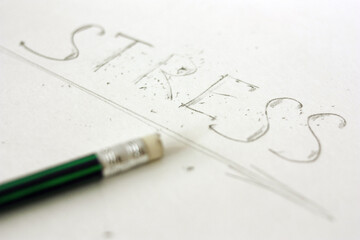 The eraser erases the word `Stress`