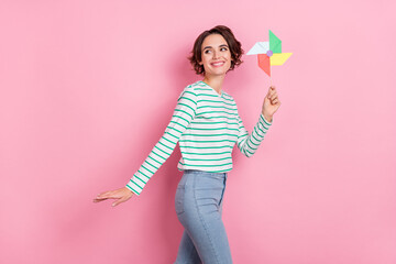 Profile photo of funny young bob hairdo lady hold spinner look ad wear striped shirt isolated on...