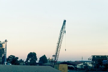 Crane moving items in a construction zone