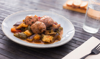 steamed meatballs with stewed vegetables with haze on plate