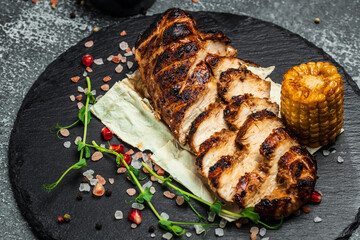 Ketogenic diet food, grilled chicken fillet. Barbecued chicken breasts on slate plate, Roasted Chicken fillet with vegetables, healthy meal concept, top view