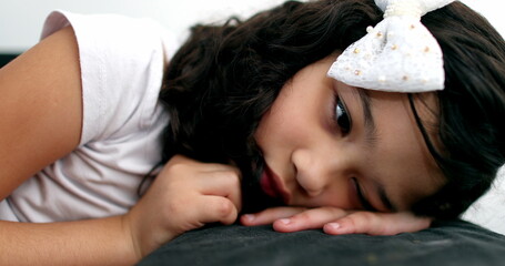 Pensive little girl child thinking, Thoughtful sad kid feeling bored
