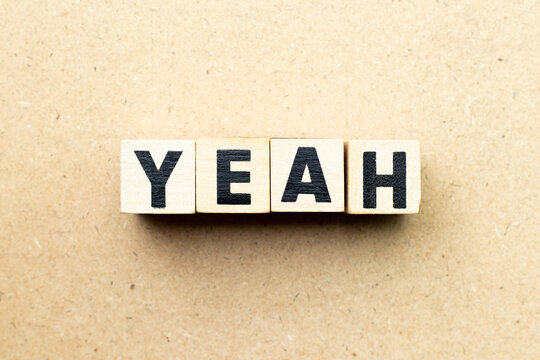 Alphabet letter block in word yeah on wood background