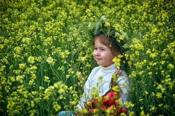 Child girl on a walk in the field