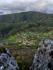 Overview of Fajãzinha nestled on the southeastern slope of a wide valley. View between 2 rocks from the Miradouro do Portal.
Lajes das Flores, Flores Island.