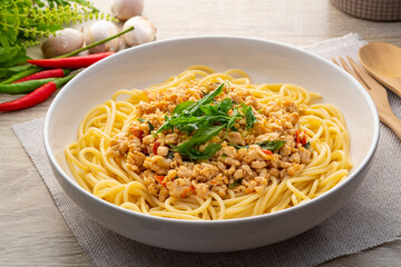 Spaghetti topped with stir fried minced chicken and basil,Spicy pasta Pad Kra Pao,Thai fusion food