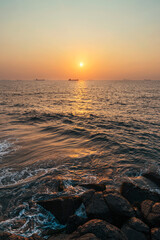 Beautiful Sunset Over Ocean With Ships in the Horizon