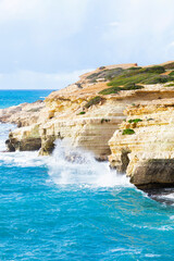 Ocean waves splash against beach with rocks background, Cliffs in the sea, Top aerial view of Cyprus, Nature Background with Sea, Vacation and relax