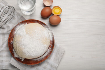 Flat lay composition with dough and ingredients on white wooden table, space for text. Sodawater bread recipe