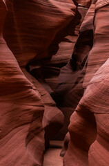 Waves formed by orange and red sand in between canyons, Arizona