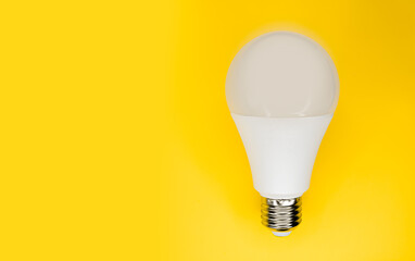 A beautiful white light bulb on a minimalist background. Idea lamp.