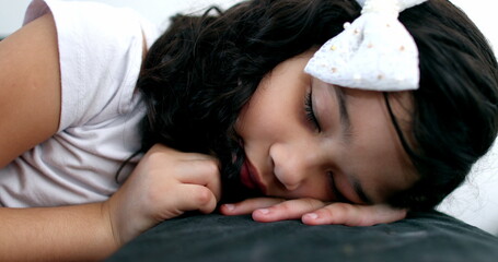 Little girl child lying down to nap