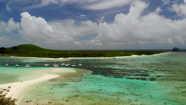 Aerial view on a bay with catamarans between Flat and Gabriel islands 