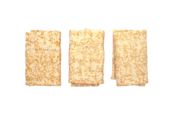 Three rolled pancakes with filling  isolated on white background. Stuffed crepes. Top view.