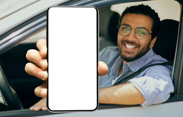 Happy indian driver using showing smartphone with empty screen