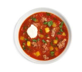 Bowl of delicious stuffed pepper soup on white background, top view