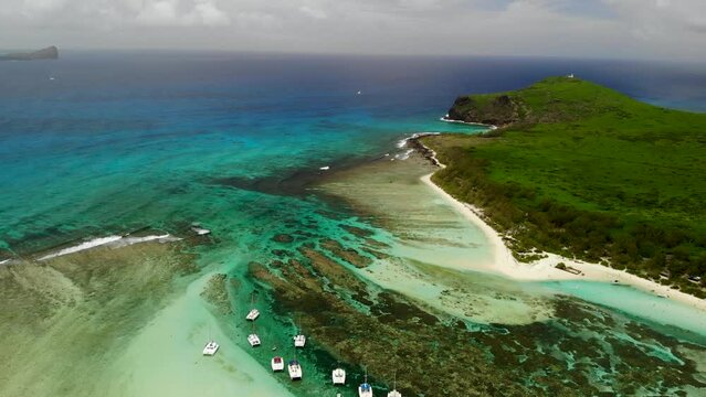 Aerial view on a bay with catamarans between Flat and Gabriel islands 